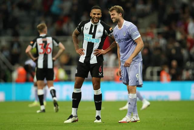 Leeds United striker Patrick Bamford pictured alongside Newcastle United captain Jamaal Lascelles (Photo by Ian MacNicol/Getty Images)