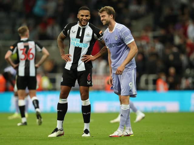 Leeds United striker Patrick Bamford pictured alongside Newcastle United captain Jamaal Lascelles (Photo by Ian MacNicol/Getty Images)