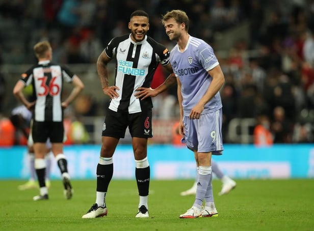 Leeds United striker Patrick Bamford pictured alongside Newcastle United captain Jamaal Lascelles (Photo by Ian MacNicol/Getty Images)