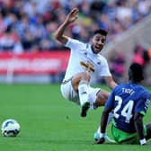 SWANSEA, WALES - OCTOBER 04:  Newcastle player Chieck Tiote (r) beats Neil Taylor to the ball during the Barclays Premier League match between Swansea City and Newcastle United at Liberty Stadium on October 4, 2014 in Swansea, Wales.  (Photo by Stu Forster/Getty Images)