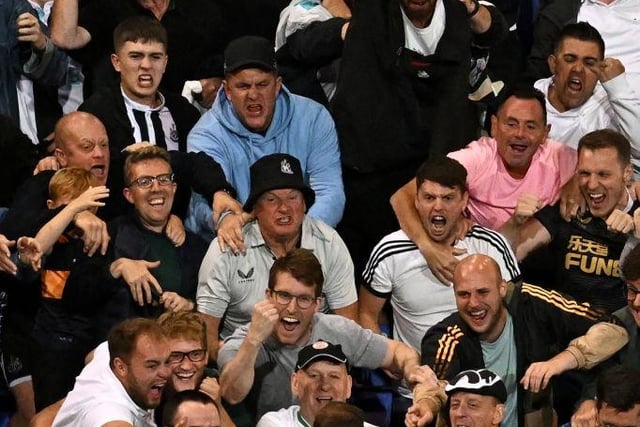 Newcastle United fans celebrating Chris Wood's winner against Tranmere Rovers in the Carabao Cup (Photo by PAUL ELLIS/AFP via Getty Images)