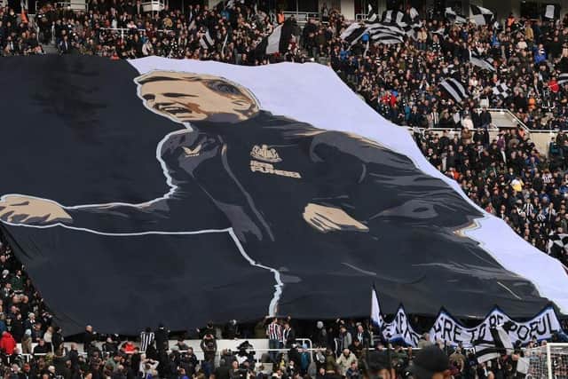 Newcastle United fans unveil a Wor Flags surfer bearing the image of head coach Eddie Howe.