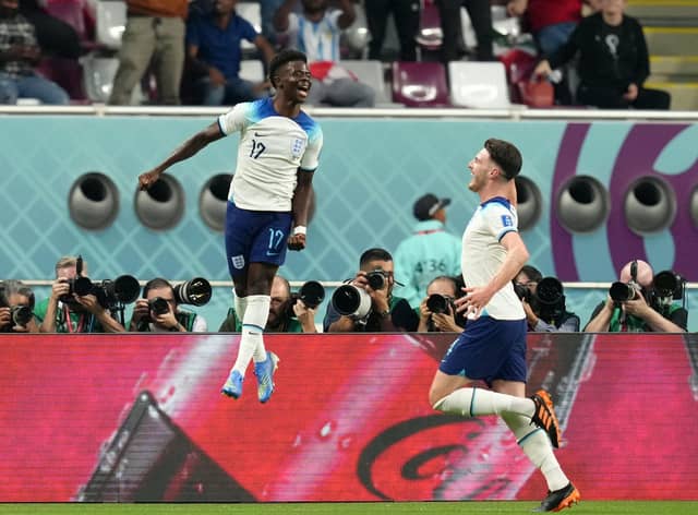 I'LL SECOND THAT: England's Bukayo Saka celebrates scoring the second goal against Group B rivals Iran with Declan Rice (right) at the Khalifa International Stadium. Picture: Nick Potts/PA
