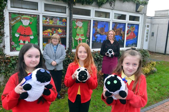 The "messy sheep" window display at Jarrow Cross C of E School. Pupils from left Grace Davis, ten, Ava-Rose McGibbon, nine and Chloe Sawkill, nine with Rev. Lesley Jones and headteacher Susan McBeth. The girls are in  the same bubble.