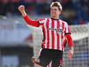 Dennis Cirkin celebrates his goal at Cardiff City