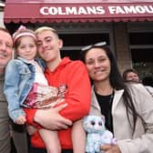 Tom and Michaela Atkinson along with Heidi, five, and Joe ,16, wait for Good Friday fish and chips at Colmans.