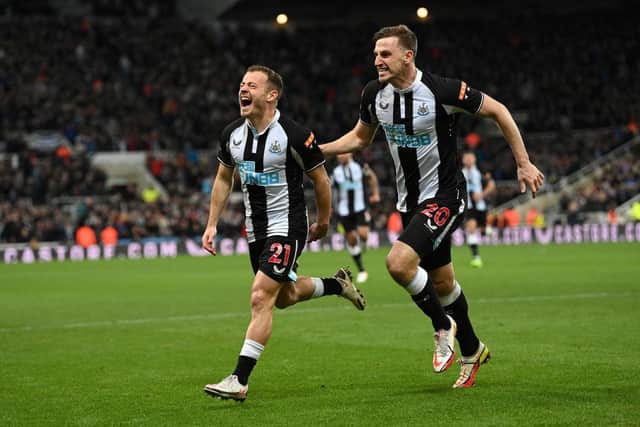 Newcastle player Ryan Fraser (l) celebrates with Chris Wood after scoring the second Newcastle goal during the Premier League match between Newcastle United  and  Everton at St. James Park on February 08, 2022 in Newcastle upon Tyne, England. (Photo by Stu Forster/Getty Images)