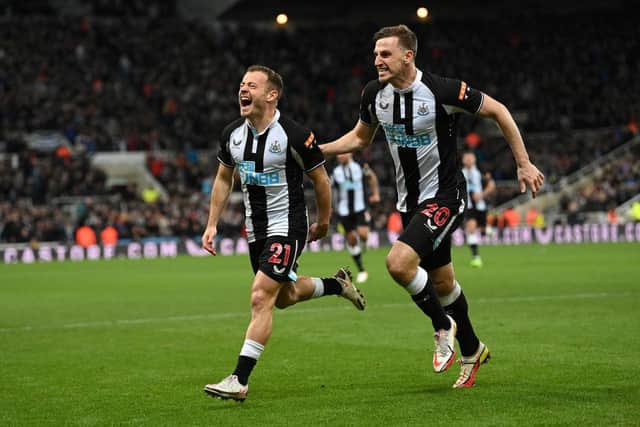 Newcastle player Ryan Fraser (l) celebrates with Chris Wood after scoring the second Newcastle goal during the Premier League match between Newcastle United and Everton at St. James Park on February 08, 2022 in Newcastle upon Tyne, England. (Photo by Stu Forster/Getty Images)