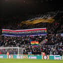 Fans hold up a banner in support of the 'Rainbow Laces' campaign during the Premier League match between Newcastle United and Burnley at St. James Park on December 04, 2021 in Newcastle upon Tyne, England. (Photo by Stu Forster/Getty Images)