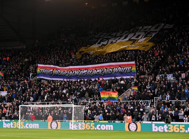 Fans hold up a banner in support of the 'Rainbow Laces' campaign during the Premier League match between Newcastle United and Burnley at St. James Park on December 04, 2021 in Newcastle upon Tyne, England. (Photo by Stu Forster/Getty Images)