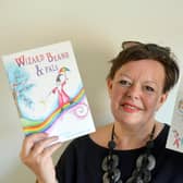 Author Paula Fowler with the first in her trilogy, Wizard Beano and Pals and the accompanying activities sheet. Picture, Sunderland Echo.