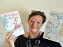 Author Paula Fowler with the first in her trilogy, Wizard Beano and Pals and the accompanying activities sheet. Picture, Sunderland Echo.