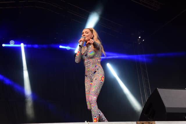 Headline act Whigfield reportedly pointed out what appeared to be fighting in the crowd.