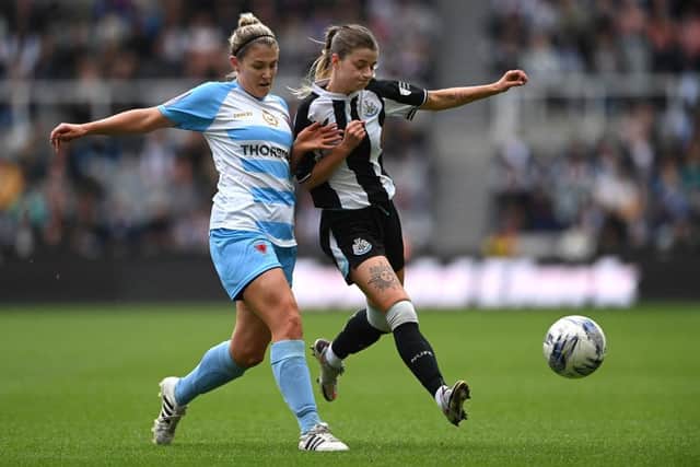 Newcastle player Kacie Elson is challenged by Alnwick Town defender Kirsty Armstrong during the FA Women's National League Division One North match against Alnwick Town Ladies at St James' Park on May 01, 2022 in Newcastle upon Tyne, England. (Photo by Stu Forster/Getty Images)