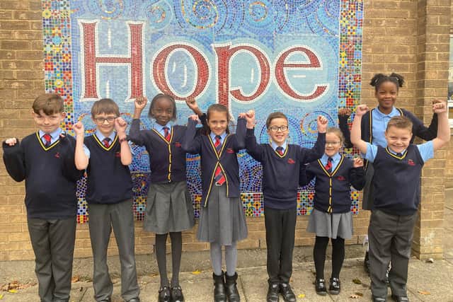 Pupils from St Aloysius Catholic Junior School Academy celebrate their outstanding Ofsted judgement.