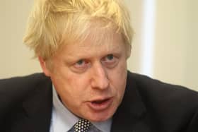 Prime Minister Boris Johnson is under fire for his handling of school exams and plans for a return to the classroom.
