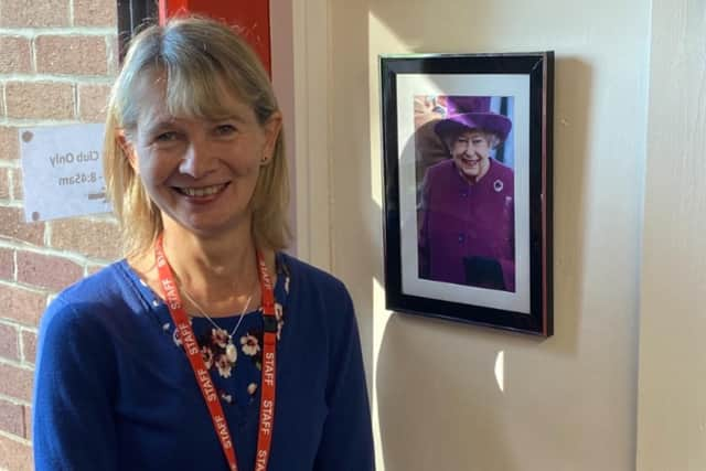 Mary Jordan, a teacher at St Joseph’s pictured with the plaque honouring the Royal Visit remembers it well.