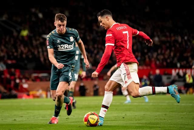 Middlesbrough defender Dael Fry in action with Manchester United's Cristiano Ronaldo (Photo by Ash Donelon/Manchester United via Getty Images)