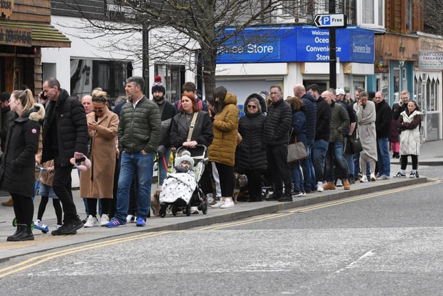 The Good Friday fish and chip customers queue in Ocean Road.
