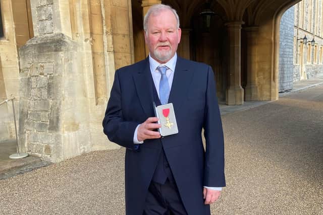Terry Fitzpatrick at Windsor Castle with his OBE.