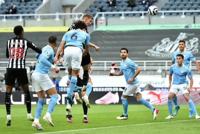 Newcastle United's Swedish defender Emil Krafth (4L) scores the opening goal during the English Premier League football match between Newcastle United and Manchester City at St James' Park in Newcastle-upon-Tyne, north east England on May 14, 2021.