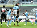 Newcastle United's Swedish defender Emil Krafth (4L) scores the opening goal during the English Premier League football match between Newcastle United and Manchester City at St James' Park in Newcastle-upon-Tyne, north east England on May 14, 2021.
