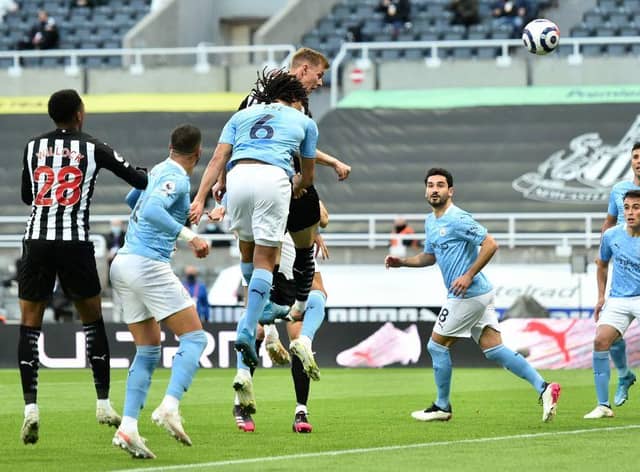 Newcastle United's Swedish defender Emil Krafth (4L) scores the opening goal during the English Premier League football match between Newcastle United and Manchester City at St James' Park in Newcastle-upon-Tyne, north east England on May 14, 2021.