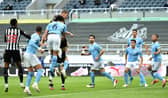Newcastle United's Swedish defender Emil Krafth (4L) scores the opening goal during the English Premier League football match between Newcastle United and Manchester City at St James' Park in Newcastle-upon-Tyne, north east England on May 14, 2021.