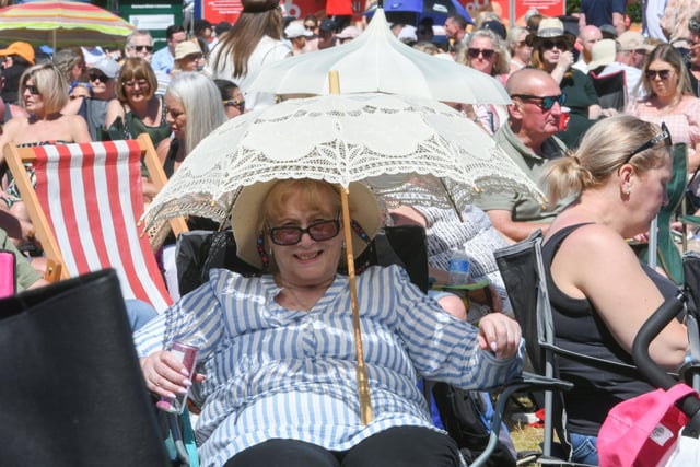 Protection from the heat at the South Tyneside Festival concert in Bents Park today.