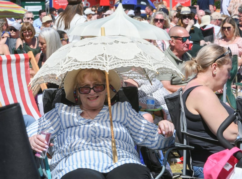 Protection from the heat at the South Tyneside Festival concert in Bents Park today.
