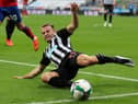 Newcastle United's Scottish midfielder Ryan Fraser stretches for the ball during the English League Cup second round football match between Newcastle United and Blackburn Rovers at St James' Park in Newcastle upon Tyne in north east England on September 15, 2020.