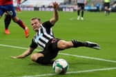 Newcastle United's Scottish midfielder Ryan Fraser stretches for the ball during the English League Cup second round football match between Newcastle United and Blackburn Rovers at St James' Park in Newcastle upon Tyne in north east England on September 15, 2020.