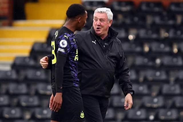 Steve Bruce manager of Newcastle United with Joe Willock after the Premier League match between Fulham and Newcastle United at Craven Cottage on May 23, 2021 in London, United Kingdom.