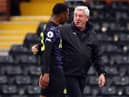 Steve Bruce manager of Newcastle United with Joe Willock after the Premier League match between Fulham and Newcastle United at Craven Cottage on May 23, 2021 in London, United Kingdom.