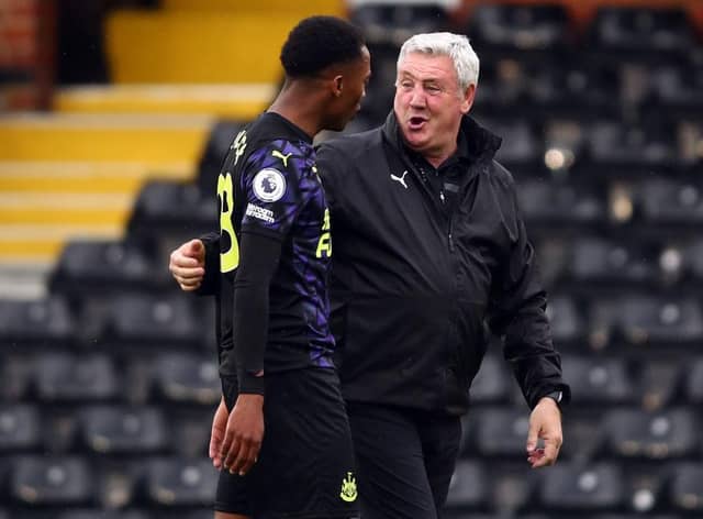 Steve Bruce manager of Newcastle United with Joe Willock after the Premier League match between Fulham and Newcastle United at Craven Cottage on May 23, 2021 in London, United Kingdom.