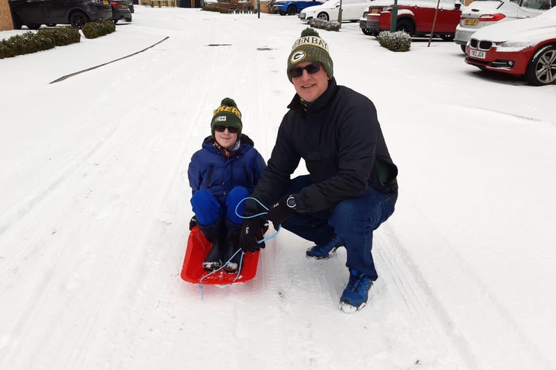 Stuart Rosamond and his son Harry, 9 braved the cold on Sunniside Lane.