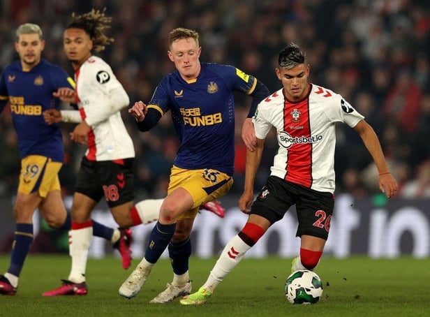 Newcastle United's English midfielder Sean Longstaff (2R) vies with Southampton's Argentinian midfielder Carlos Alcaraz (R) during the English League Cup semi-final first-leg football match between Southampton and Newcastle United at St Mary's Stadium in Southampton, southern England on January 24, 2023. (Photo by ADRIAN DENNIS/AFP via Getty Images)