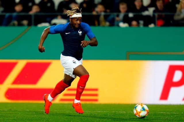 France's Allan Saint Maximim runs with the ball during the friendly under-21 football match between Germany and France in Essen, western Germany on March 21, 2019. (Photo by LEON KUEGELER / AFP)