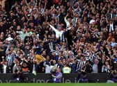 Newcastle United fans celebrate a goal from Miguel Almiron at Craven Cottage this month.