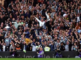 Newcastle United fans celebrate a goal from Miguel Almiron at Craven Cottage this month.