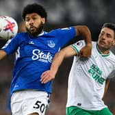 Newcastle United's Swiss defender Fabian Schar (R) vies with Everton's English striker Ellis Simms during the English Premier League football match between Everton and Newcastle United at Goodison Park in Liverpool, north-west England on April 27, 2023. (Photo by Oli SCARFF / AFP)