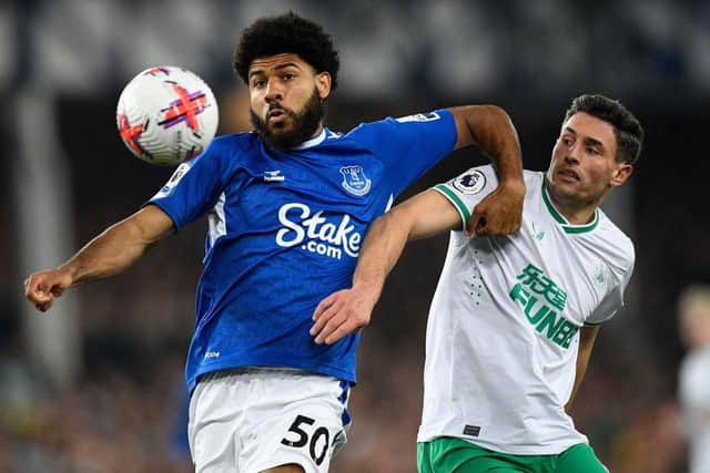 Newcastle United's Swiss defender Fabian Schar (R) vies with Everton's English striker Ellis Simms during the English Premier League football match between Everton and Newcastle United at Goodison Park in Liverpool, north-west England on April 27, 2023. (Photo by Oli SCARFF / AFP)