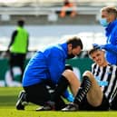 Ciaran Clark receives treatment during a game last month.
