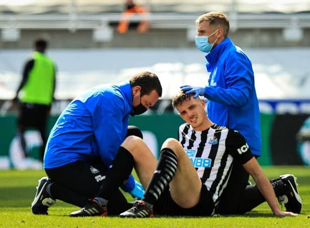 Ciaran Clark receives treatment during a game last month.