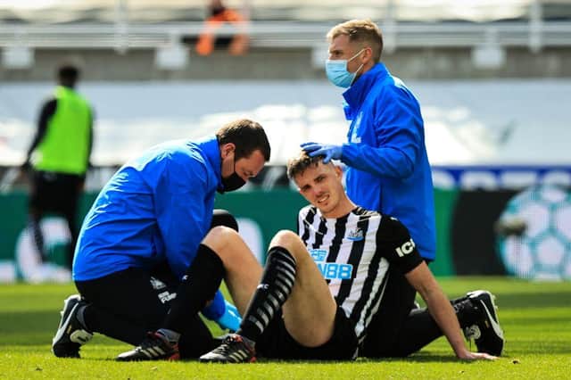 Ciaran Clark receives treatment during a game last month.