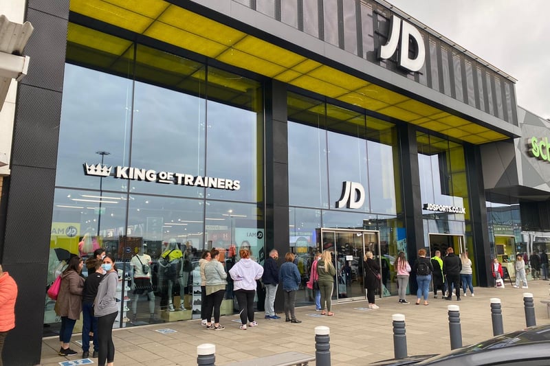 Busy day ahead for shopping centres in Edinburgh as all non-essential retail reopens for the first time in months. Here customers are seen queuing outside JD Sports at Fort Kinnaird.