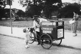 World Ice Cream Day is on July 17 - so we've been asking about your favourite childhood ice creams and lollies! Back to 1935 for this great Walls Ice Cream shot. Picture: David Savill/Topical Press Agency/Getty Images.