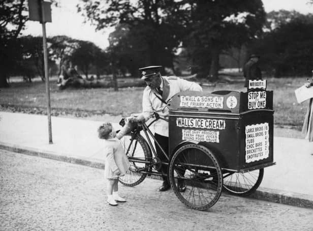 World Ice Cream Day is on July 17 - so we've been asking about your favourite childhood ice creams and lollies! Back to 1935 for this great Walls Ice Cream shot. Picture: David Savill/Topical Press Agency/Getty Images.