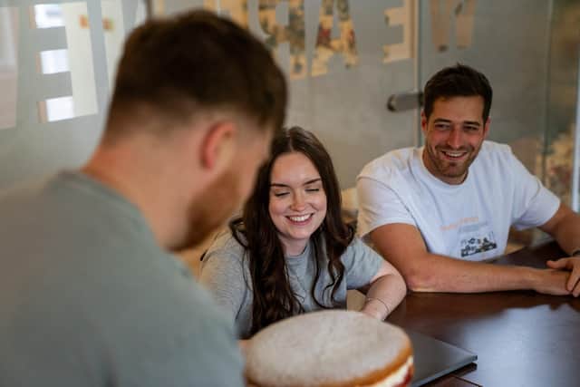 A team smiling at a Best Office Baker entry
