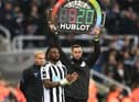Newcastle United's Allan Saint-Maximin waits to come on against Aston Villa.